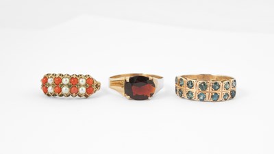 Lot 115 - Three yellow metal gem set dress rings