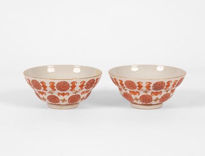 Lot 624 - A pair of Chinese iron red and gilt decorated 'Bats and Shou-character' bowls