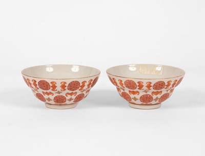 Lot 624 - A pair of Chinese iron red and gilt decorated 'Bats and Shou-character' bowls
