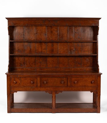 Lot 693 - A George III style oak dresser