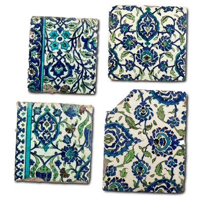 Lot 561 - Four various Damascus pottery tiles