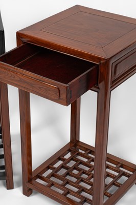 Lot 638 - A pair of Chinese hardwood urn stands or occasional tables
