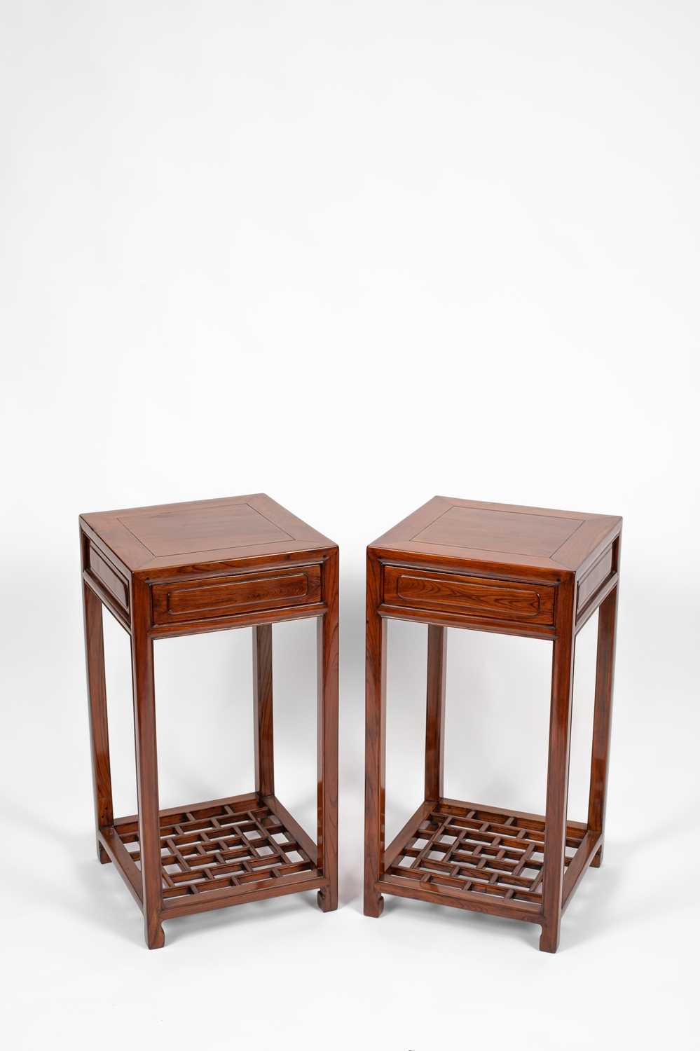 Lot 638 - A pair of Chinese hardwood urn stands or occasional tables