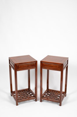 Lot 638 - A pair of Chinese hardwood urn stands or occasional tables