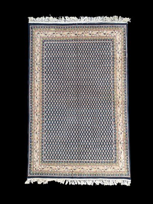 Lot 723 - An Indian carpet of Serrabend design