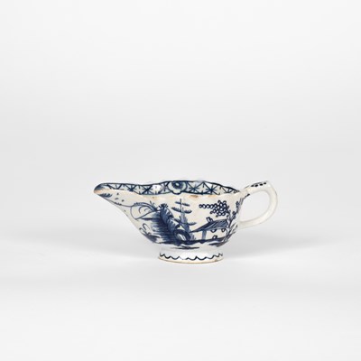 Lot 514 - A small Bow blue and white oval fluted creamboat