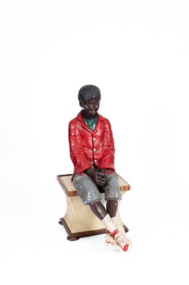 Lot 337 - A Goldscheider type figure of a sitting boy