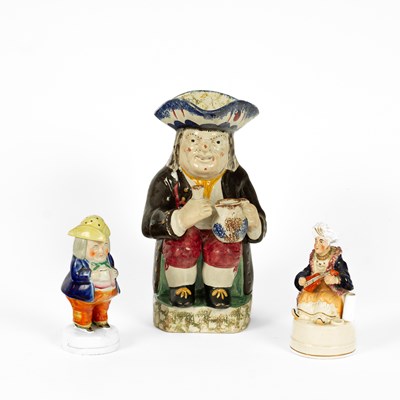 Lot 367 - A traditional Staffordshire pearlware Toby jug