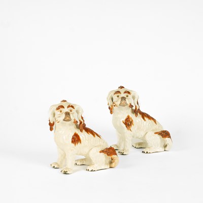 Lot 368 - Two porcelain brown and white models of Bolognese terriers