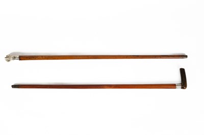 Lot 451 - A Malacca cane with a plated handle