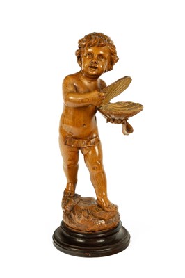 Lot 327 - A carved pine figure of a putti