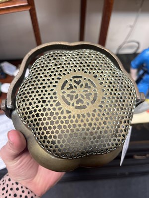 Lot 633 - A Chinese brass brazier or handwarmer