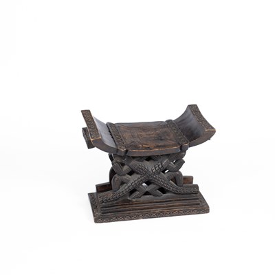 Lot 651 - An African carved stool