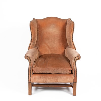 Lot 653 - A George III style wingback armchair