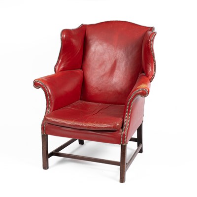 Lot 659 - A George III style red leather upholstered wing armchair