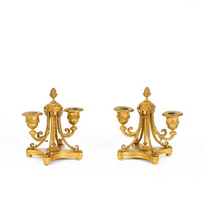 Lot 427 - A pair of gilt metal two-branch candelabra