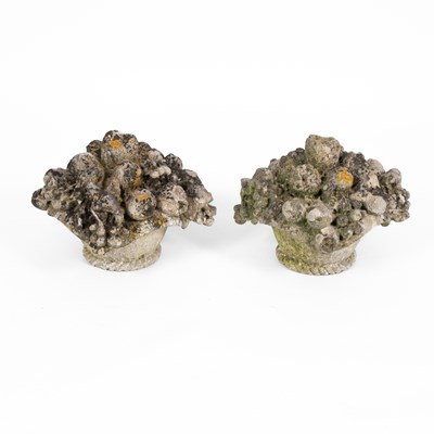 Lot 520 - A pair of reconstituted stone baskets of flowers