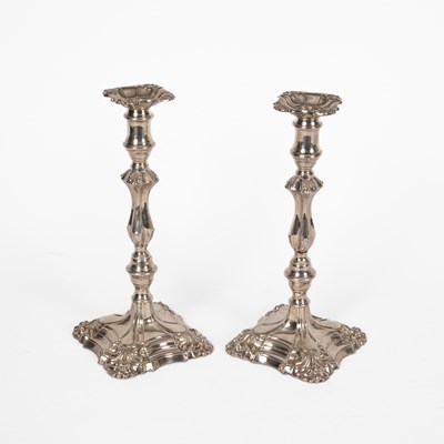 Lot 56 - A pair of 18th Century style silver candlesticks