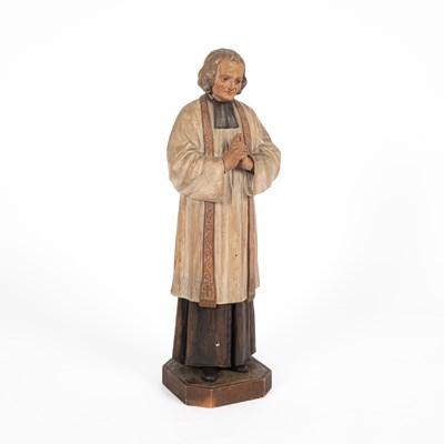 Lot 325 - A carved and painted figure of the Cure of Ars