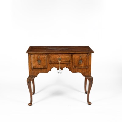 Lot 36 - A George III walnut and crossbanded lowboy