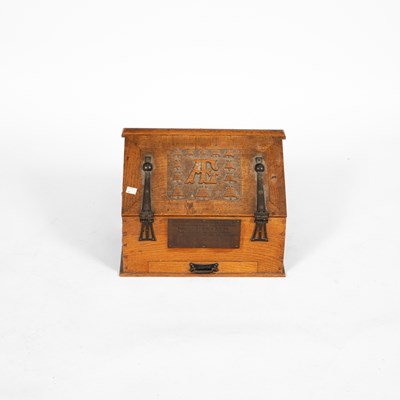 Lot 46 - An Arts & Crafts oak stationery cabinet
