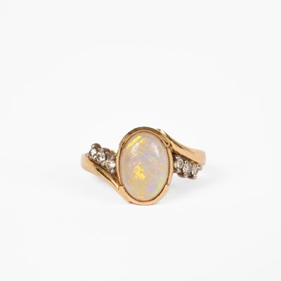 Lot 12 - An opal and diamond yellow metal dress ring