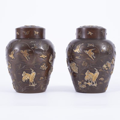 Lot 182 - A pair of Japanese mixed metal jars and covers