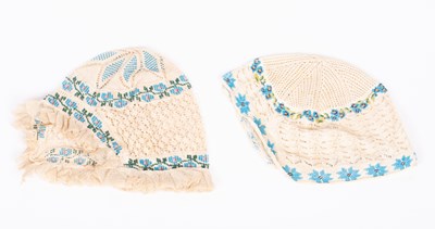 Lot 829 - Two European beaded baby's caps