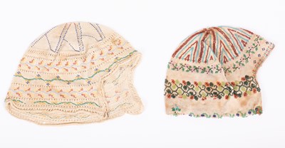 Lot 832 - Two European beaded baby's caps