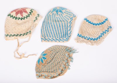 Lot 835 - Four European beaded baby's cap