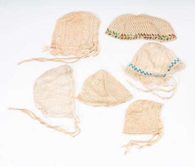 Lot 837 - Four European crochet baby's caps