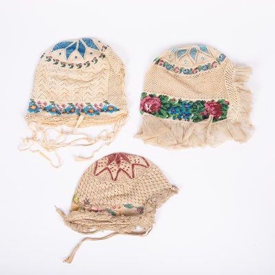 Lot 839 - Three European beaded baby's caps