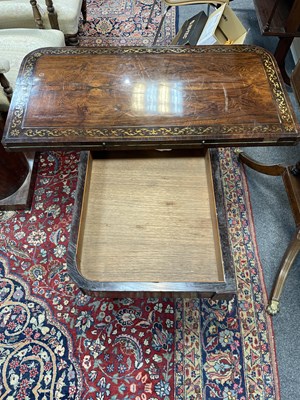 Lot 589 - A Regency rosewood and brass inlaid card table