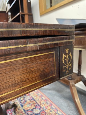 Lot 589 - A Regency rosewood and brass inlaid card table