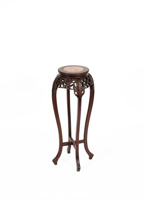 Lot 216 - A Chinese hardwood urn stand
