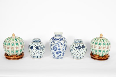 Lot 455 - A pair of Chinese famille verte pumpkin lidded vases