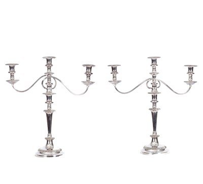 Lot 541 - A pair of silver plated three-branch candelabra