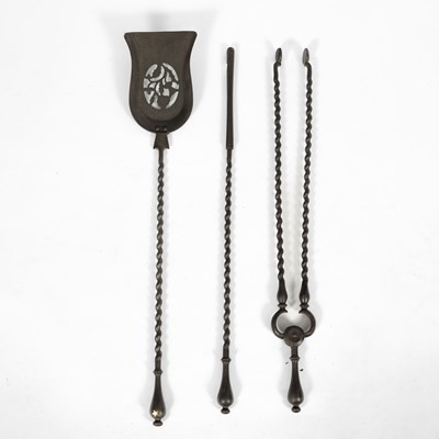 Lot 204 - A set of three cast iron fire tools