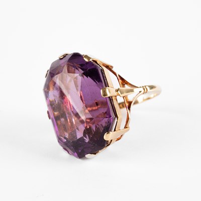 Lot 254 - A yellow metal and amethyst cocktail ring
