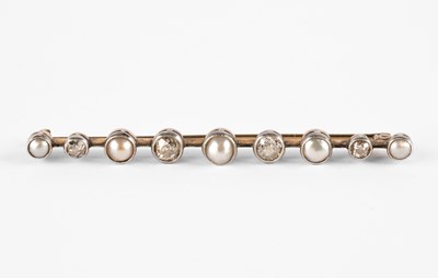 Lot 255 - An early 20th Century yellow metal diamond and pearl bar brooch