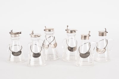 Lot 33 - Six George V silver capped glass whisky noggins