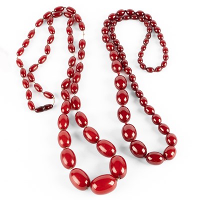 Lot 216 - Two cherry amber beaded necklaces