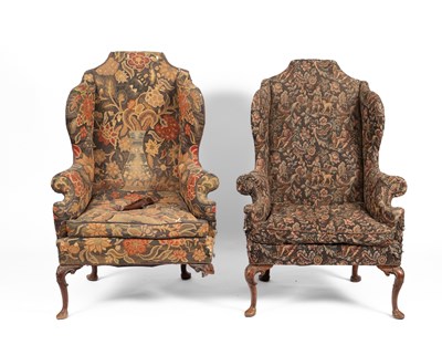 Lot 29 - A pair of upholstered wingback armchairs of Queen Anne design