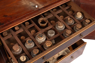 Lot 183 - A George III apothecary’s mahogany cabinet