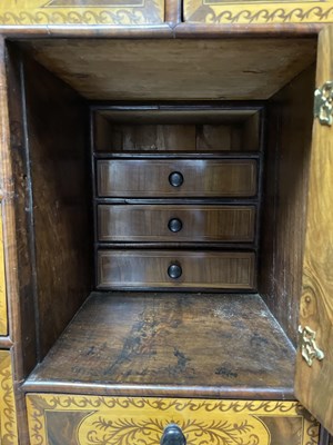 Lot 45 - A 17th Century walnut seaweed marquetry cabinet