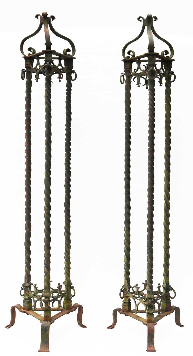 Lot 11 - A large pair of 19th Century wrought iron lamp stands