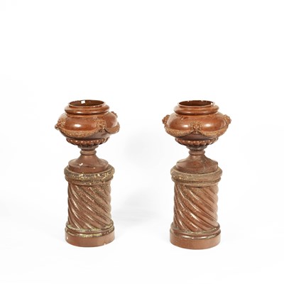 Lot 14 - A pair of treacle glazed planters on columns