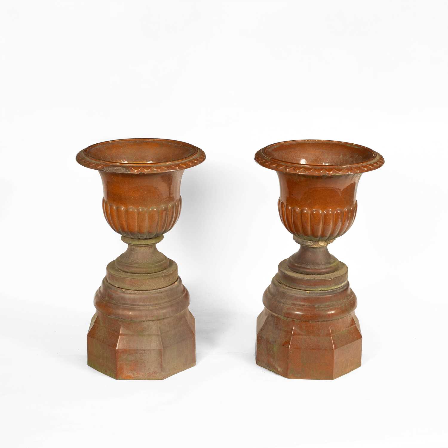 Lot 15 - A pair of Scottish salt glaze urns on plinths