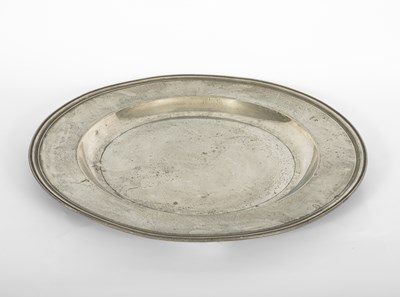 Lot 77 - An English Pewter multiple reeded charger of large size