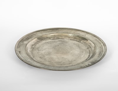 Lot 91 - An English pewter single reeded charger